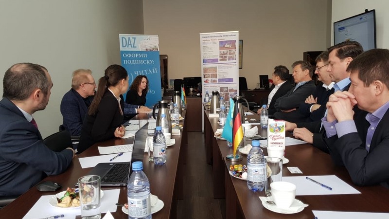 The Dedere delegation participates in a meeting with Dr Albert Rau and others.